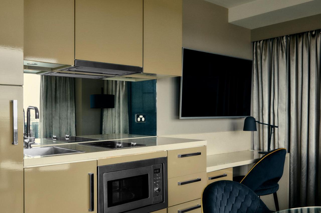 The Kinson Hotell Melbourne Eksteriør bilde A kitchen in a serviced apartment
